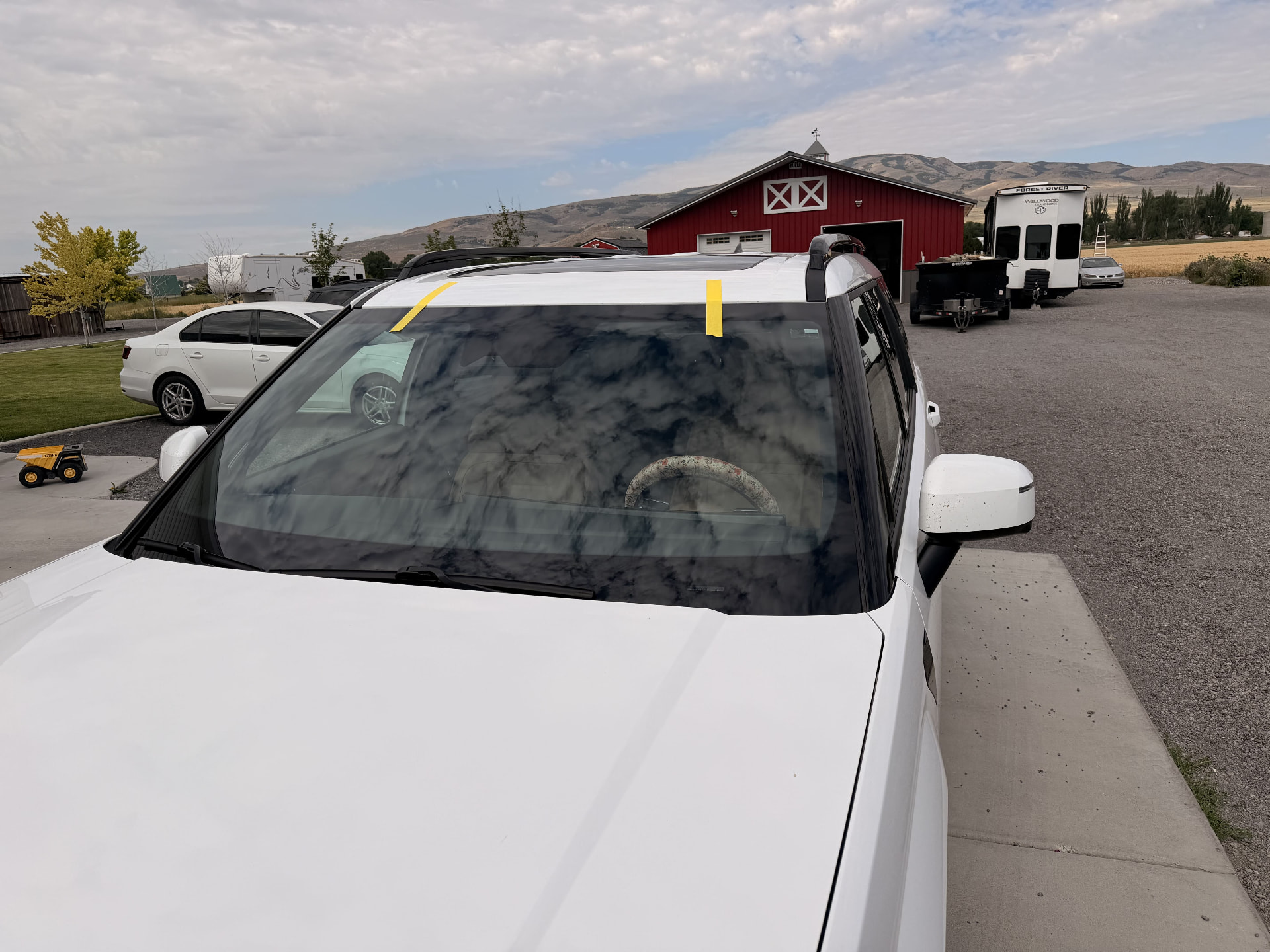 White SUV windshield replacement completed in a driveway in Northern New Jersey