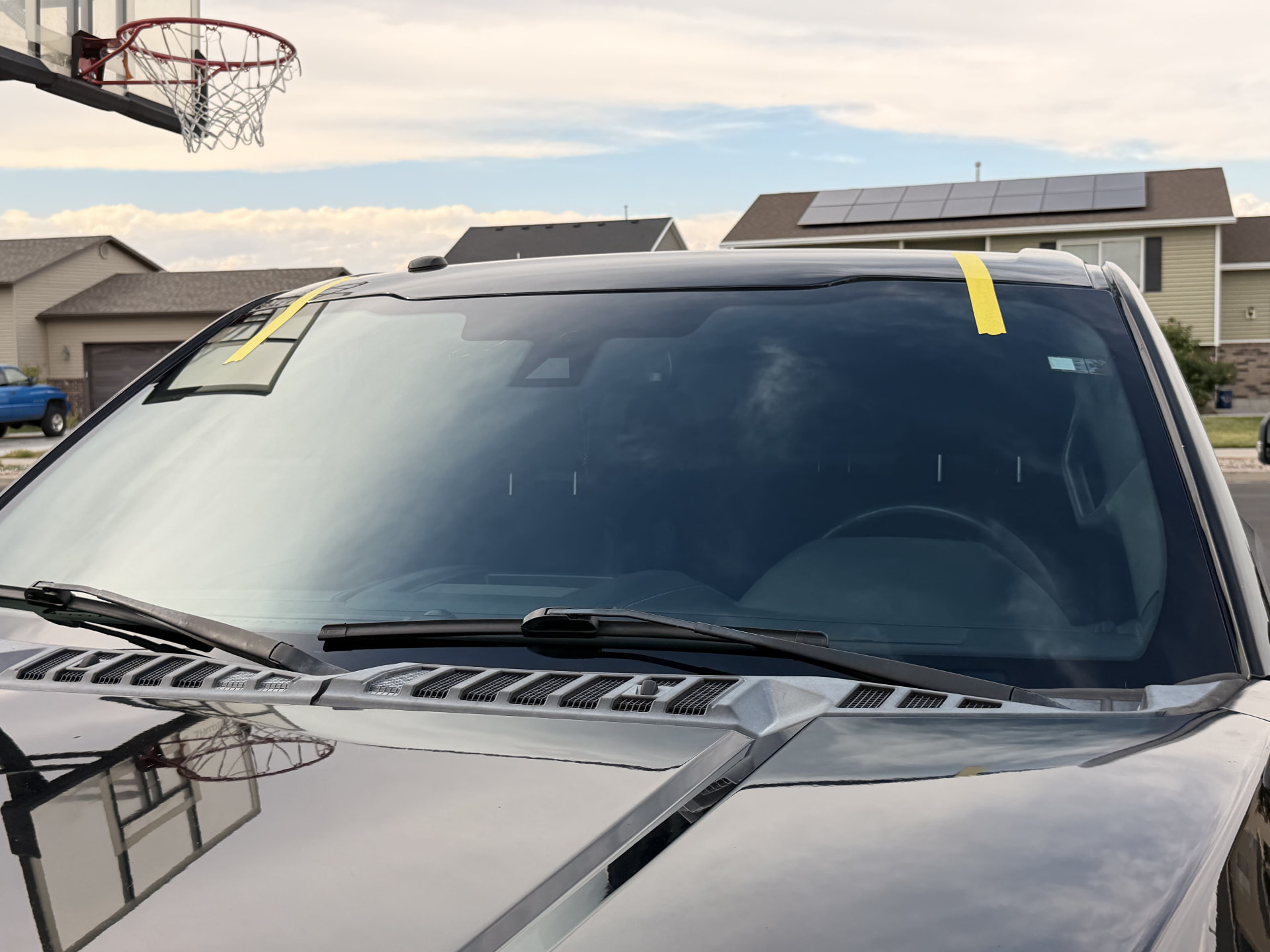 Truck windshield replaced outdoors at a customer's home