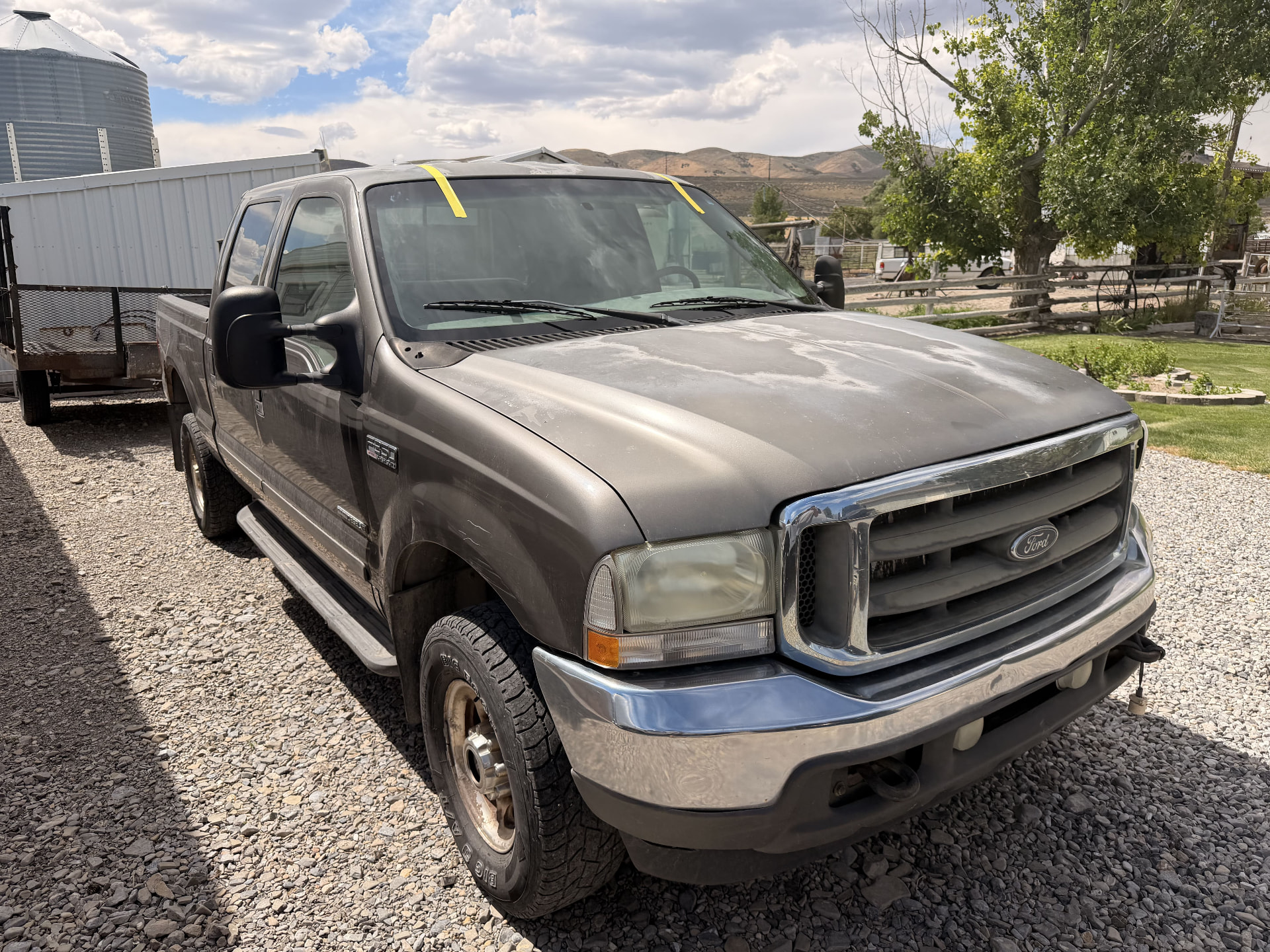 Ford Super Duty truck windshield replaced at a rural property